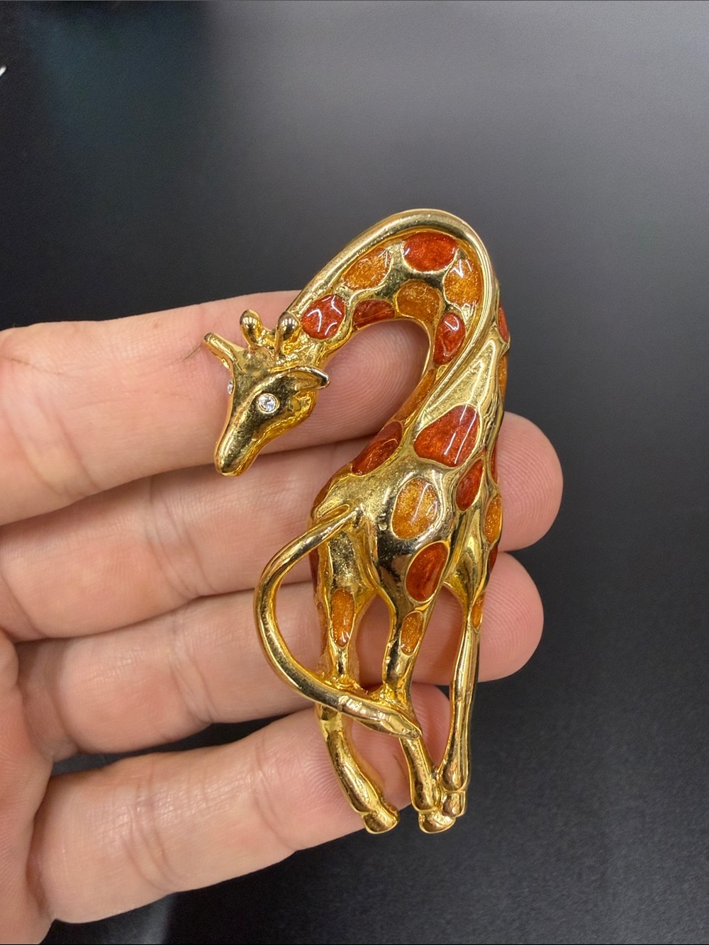 Gold Tone Giraffe Brooch with Orange Enamel Accents